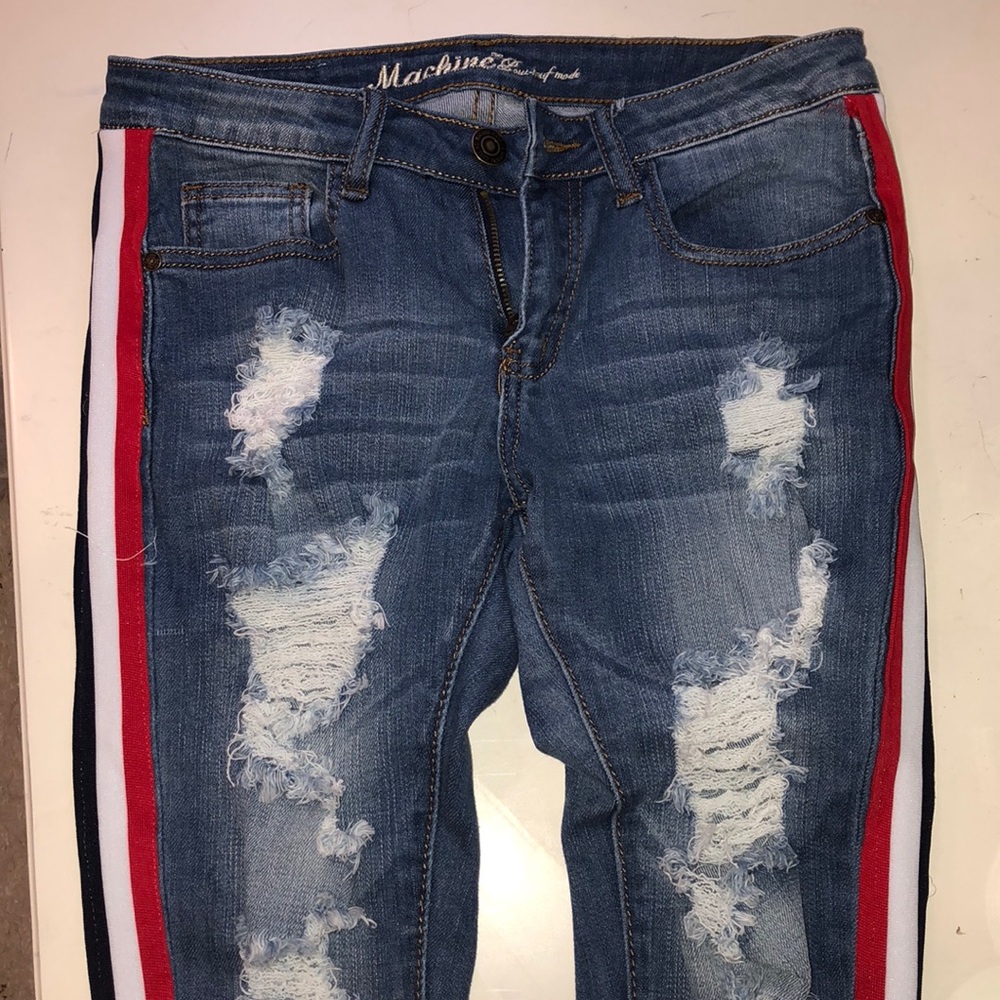Blue jeans with white, red, and dark blue stripe